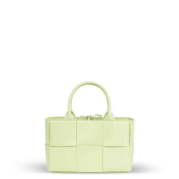 A small light green leather handbag in a braided pattern from the Bottega Veneta brand.