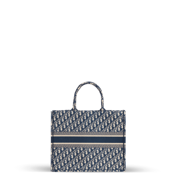 Tote bag bleu et beige en tissu jacquard de la marque Dior.