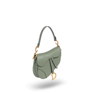 Un sac à main vert avec du matériel doré de la marque Dior.