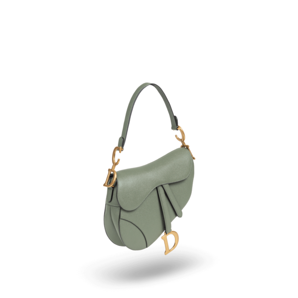 A green handbag with gold hardware from the Dior brand.