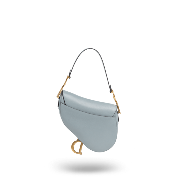 A light blue handbag with gold hardware from the Dior brand.
