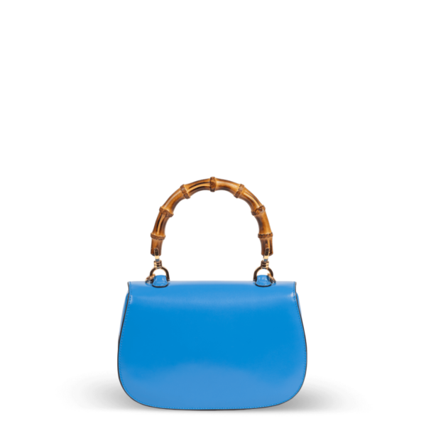 Sac à main en cuir bleu avec poignée en bambou de la marque Gucci.