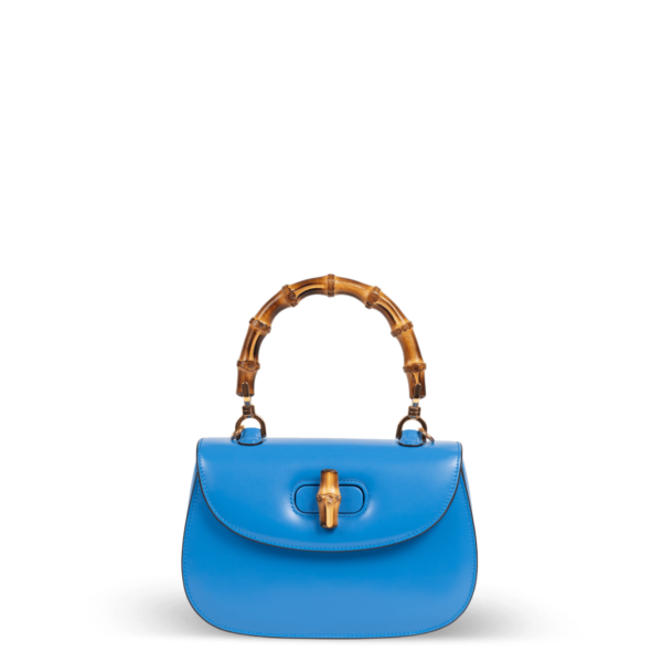 Blue leather handbag with bamboo handle by Gucci.