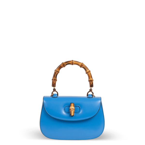 Sac à main en cuir bleu avec poignée en bambou de la marque Gucci.