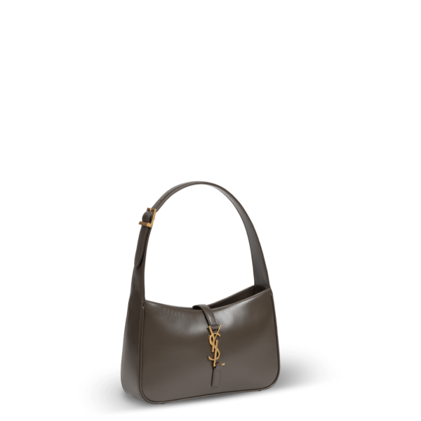 A small shoulder bag in brown leather and gold hardware from the Saint Laurent brand.
